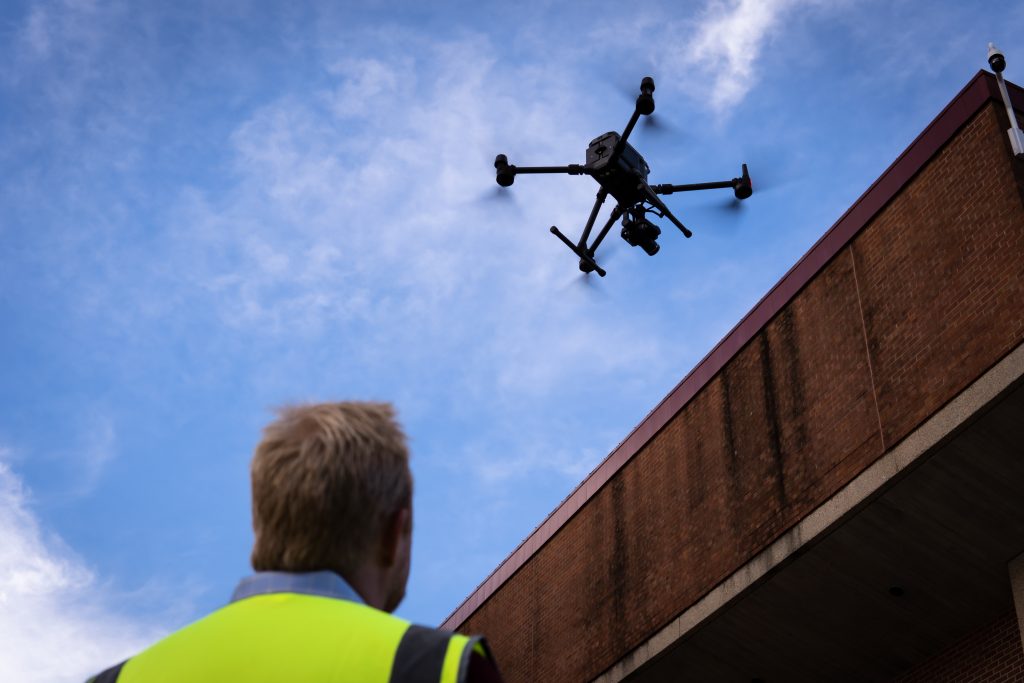 Drone and drone pilot near Steenbock Library.